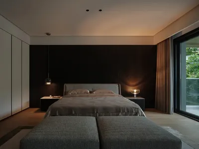 Contemporary bedroom interior with minimalist design elements, featuring a bed with a concrete headboard, grey upholstered be