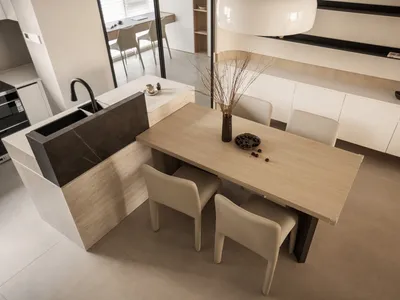現代廚房，配備大理石檯面及木製餐桌椅的用餐區