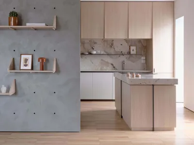 A modern residential kitchen featuring wood and marble materials.