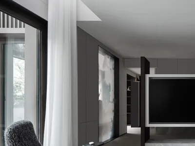 A modern living room with concrete walls and a minimalist design.