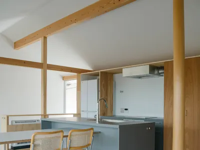 Minimalist kitchen design featuring concrete countertops and wooden elements
