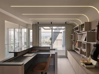 A modern home office featuring a bookshelf with a variety of items, including books, a guitar, and a vinyl record player.