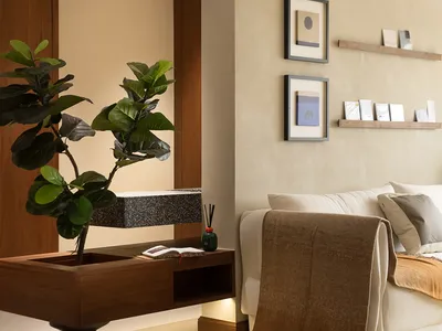 A modern minimalist bedroom with neutral materials and a floating plant pot.