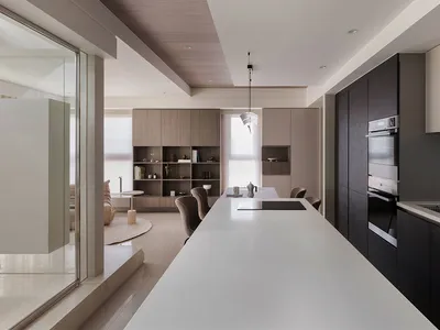 Modern minimalist kitchen with white countertops, black cabinetry, and wooden shelving.