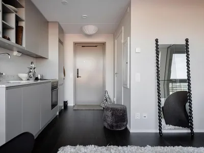Modern minimalist kitchen with metallic finishes and sleek design.