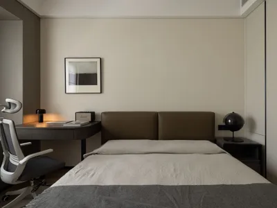Modern bedroom with sleek, contemporary design features minimalist furniture and high-quality materials.