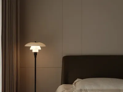 一間極簡風格的現代臥室，展示簡潔的落地燈與舒適的床鋪，搭配簡約床品
