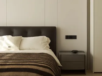 Modern bedroom with minimalist design, neutral tones, and clean lines.