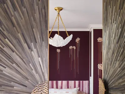 Modern bedroom with a textured fabric wall, a comfortable bed, and decorative elements.