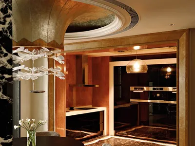 Modern kitchen featuring marble countertops and flooring.