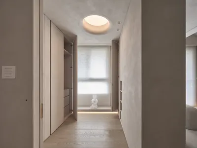 Minimalist bedroom featuring concrete ceiling and lighting.