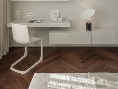 A minimalist home office featuring a floating desk, wooden shelves, and a white chair.