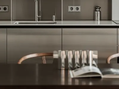 Modern kitchen with metallic finishes and minimalist design
