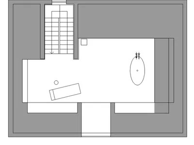 A minimalist bedroom with white walls and a wooden floor.
