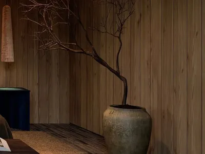 Modern minimalist bedroom with a wooden accent wall and a single branch plant in a vase.