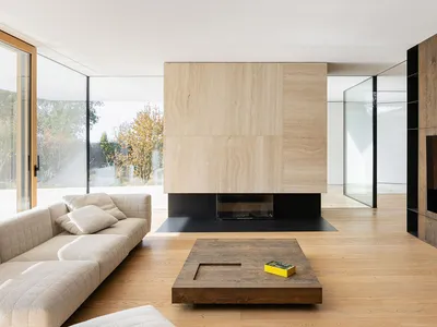 Industrial-style living room with wooden floors and furniture.