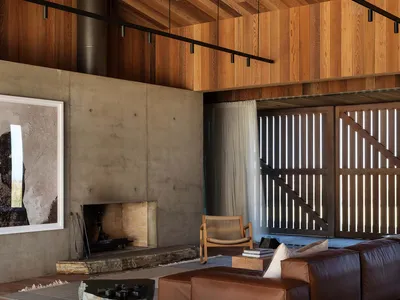 Industrial-style living room with wood elements, modern furniture, and minimalistic design.