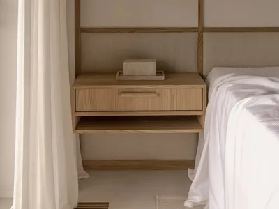 Minimalist bedroom with a floating nightstand, wooden elements, and a sleek pendant lamp.