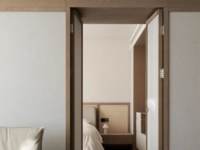 A modern minimalist bedroom featuring wood, textiles, and woven rattan elements.