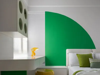 Modern bedroom featuring a green half-circle accent wall behind the bed.