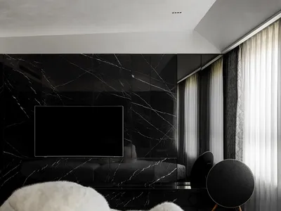 A modern bedroom with black marble walls, white furniture, and a large window.