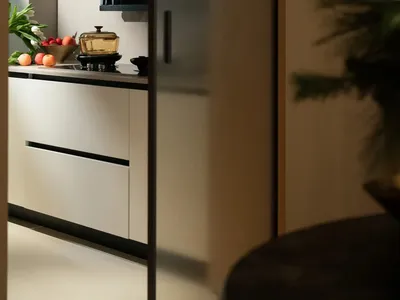 Modern kitchen with sleek, minimalist design featuring contemporary laminate materials and clean lines.