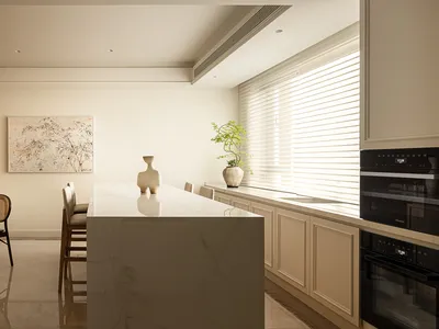 Modern minimalist residential kitchen featuring a white marble countertop, white cabinets, and white furniture.