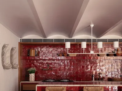 Modern kitchen with red tile backsplash and white countertops.