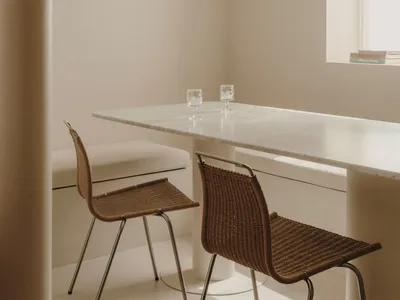 Modern minimalist kitchen with white marble table and chairs
