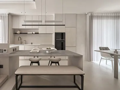 Modern, minimalist kitchen with concrete finishes and mixed materials.