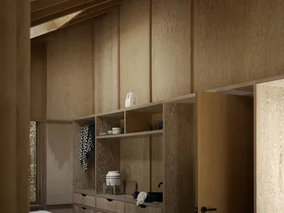 A minimalist residential kitchen featuring wooden cabinets and shelves.