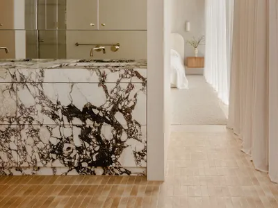 Modern bedroom featuring marble accents and minimalist design