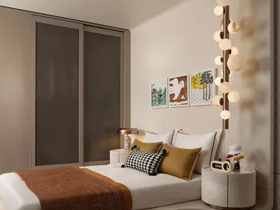 A modern minimalist bedroom featuring a bed with textured cushions and a unique light fixture.