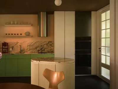 Contemporary residential kitchen featuring marble countertops, stainless steel appliances, and wooden furniture.