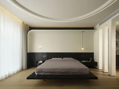 Modern minimalist bedroom with a floating platform bed, ceiling lights, and minimalistic design.