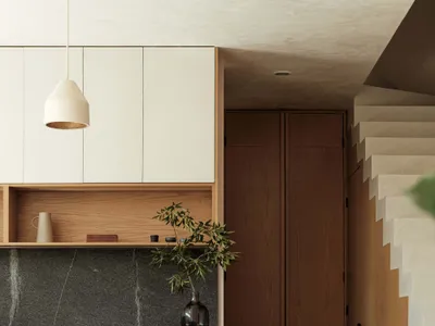 Modern kitchen featuring wooden furniture and marble countertop.