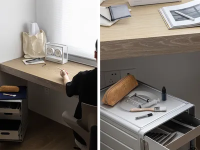 A modern home office with a wood-paneled wall, featuring a desk, chair, and various office supplies.