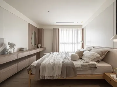 A modern minimalist bedroom with wooden elements, fabric, and textile accents.