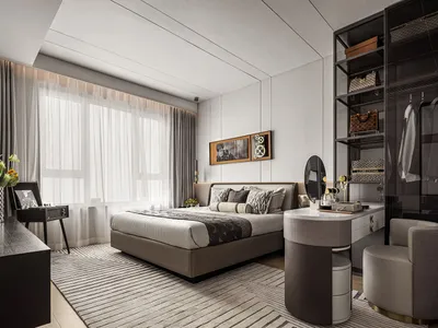 A modern minimalist bedroom featuring bed with fabric headboard, wooden floor, and white walls.