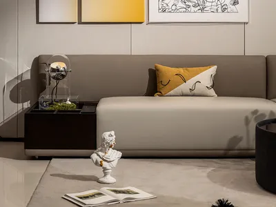 Contemporary living room with a gray sectional sofa, abstract art, and minimalist decor.