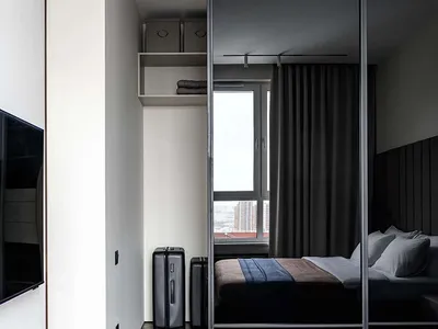 Modern, minimalist bedroom with sleek furniture and contemporary decor.