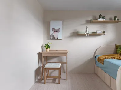 A minimalist bedroom featuring wood furniture.