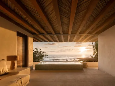 Luxurious minimalist hotel room with wooden accents