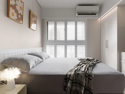 Minimalist bedroom with gray walls, bed, and furniture
