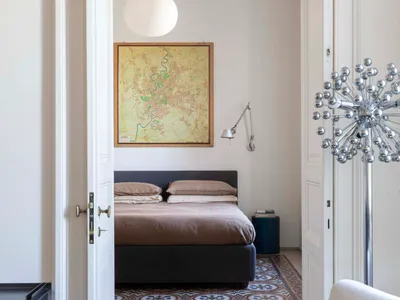 Modern bedroom featuring concrete-patterned tiles and a minimalist design.
