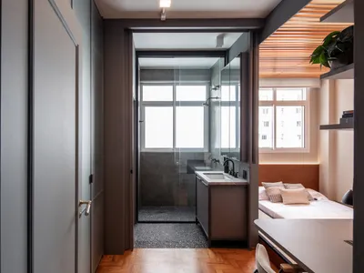 A modern, minimalist bedroom featuring industrial elements and a contemporary design.