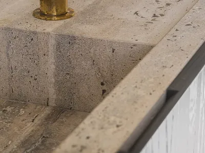 Close-up of a minimalist concrete bathroom countertop