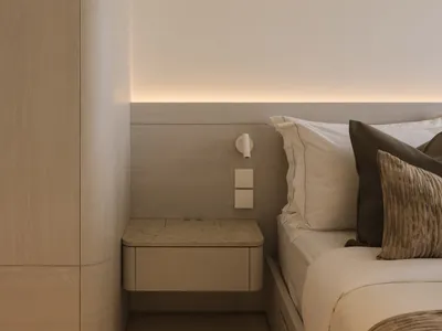 Modern minimalist bedroom featuring wood, marble, and fabric materials.