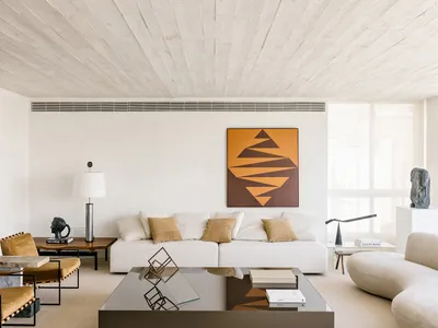Minimalist living room with neutral colors and concrete texture