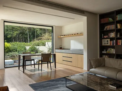 Modern living room with wooden floors and integrated kitchen area